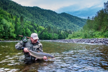 A salmon angler with his catch (EAC/Ray Plourde)